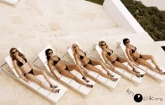 Hot bikini girls strip off and fuck each other (18 Photos)